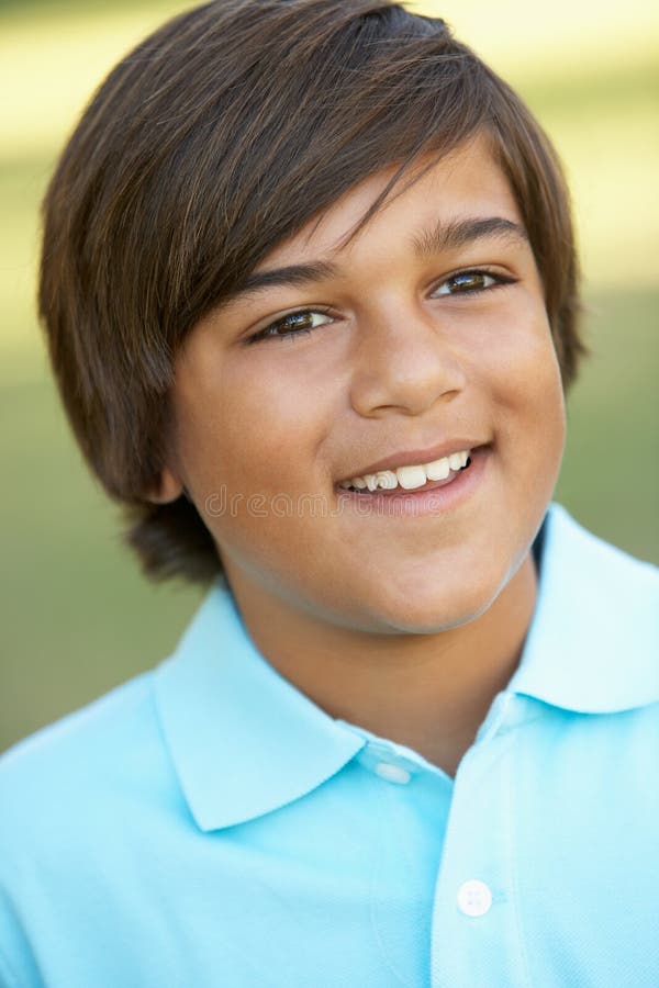 Portrait Of Young Boy In Park stock photo Portrait Of Young Boy In Park stock photo