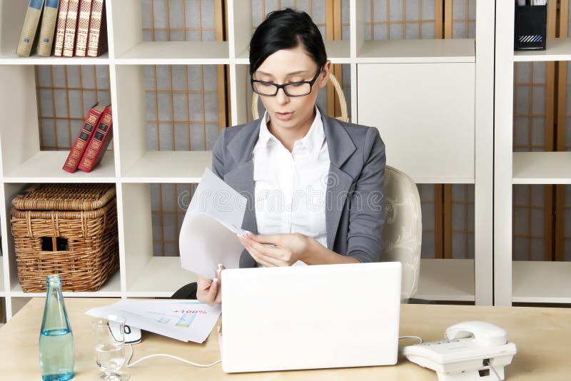 Portrait young business woman at her workplace