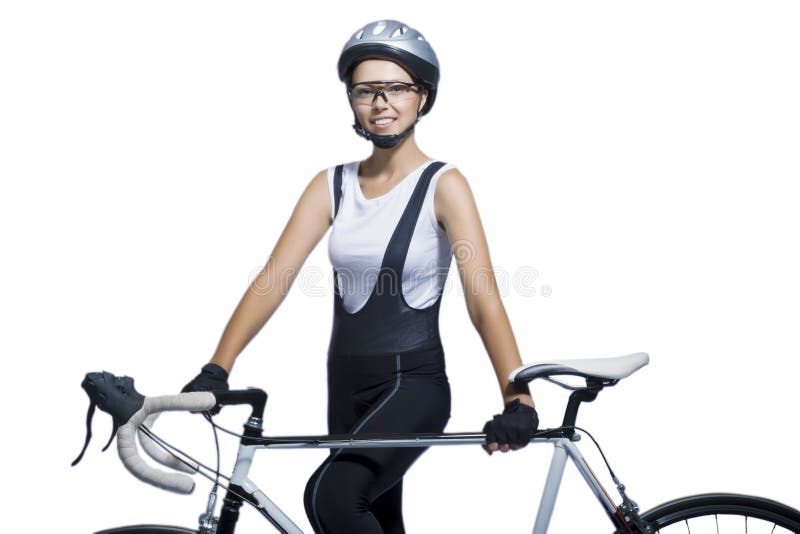 Portrait of young caucasian sportswoman professionally equipped standing with bicycle isolated over white. horizontal shot. Portrait of young caucasian sportswoman professionally equipped standing with bicycle isolated over white. horizontal shot