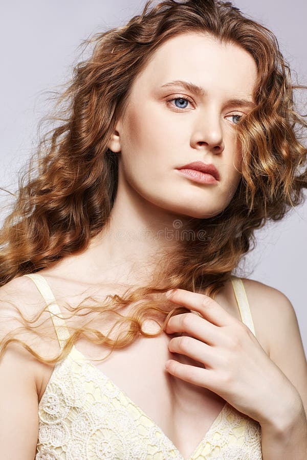 Portrait of a young caucasian woman with long golden wavy hair royalty free stock photos Portrait of a young caucasian woman with long golden wavy hair royalty free stock photos