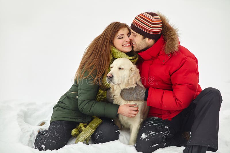Couple with a dog on winter royalty free stock photo Couple with a dog on winter royalty free stock photo
