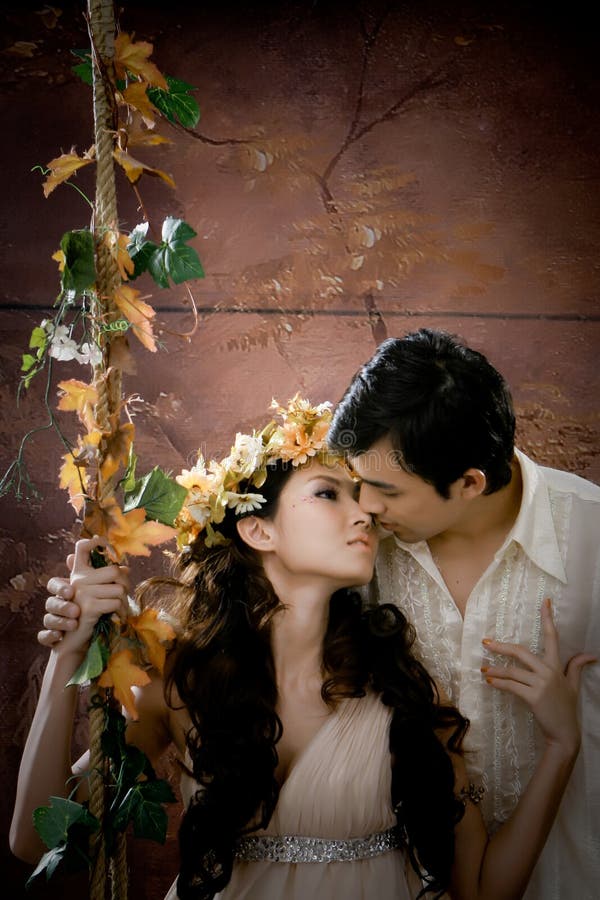 Portrait of young couple kissing each other