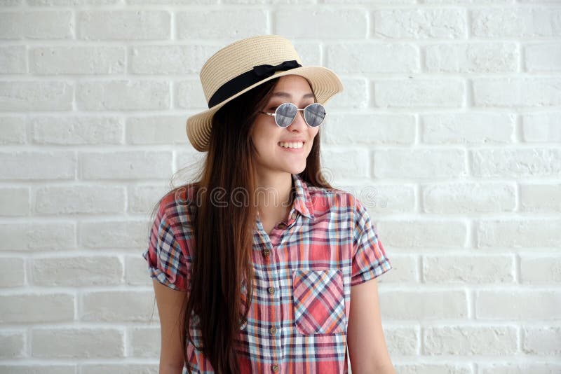 Portrait of young cute asian woman wearing sunglasses and hat sm stock images Portrait of young cute asian woman wearing sunglasses and hat sm stock images