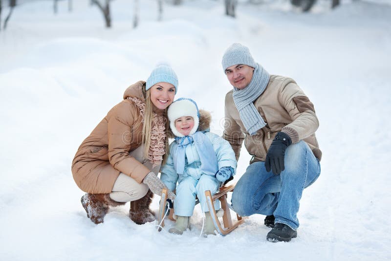 Portrait of Young family in a winter park stock image Portrait of Young family in a winter park stock image