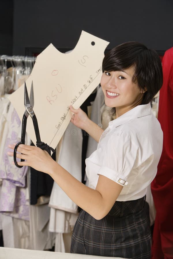 Portrait of Young Fashion Designer Working on Design Pattern Stock