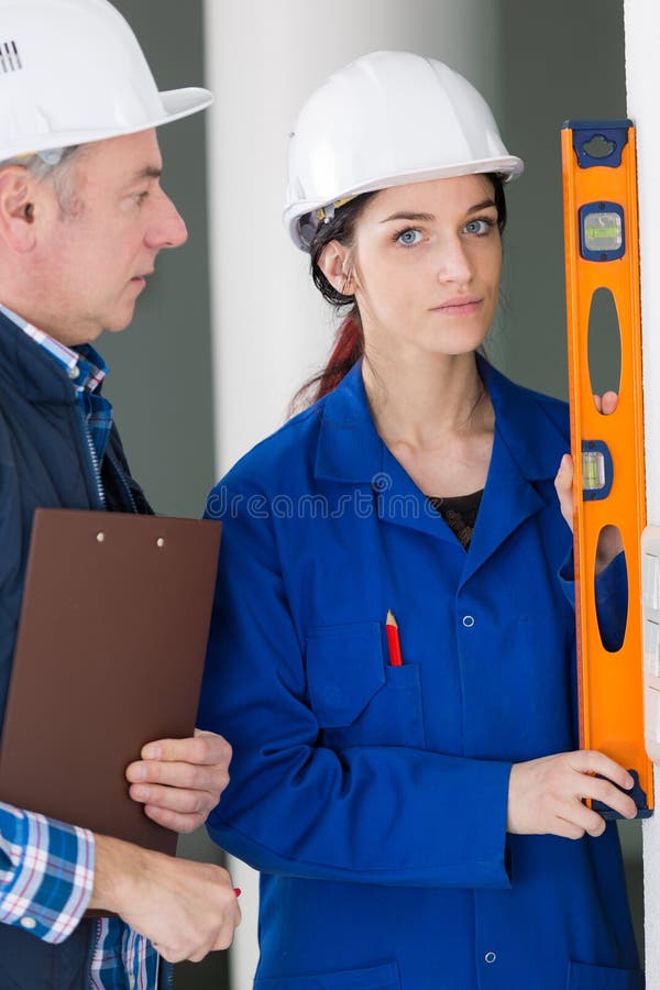 Portrait young female worker stock photos