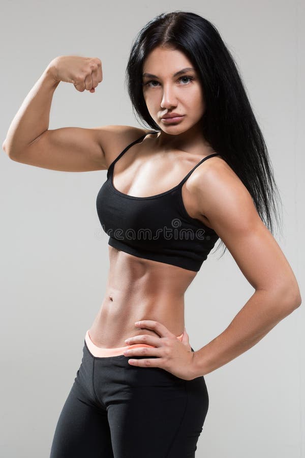 Young woman shows biceps hi-res stock photography and images - Alamy