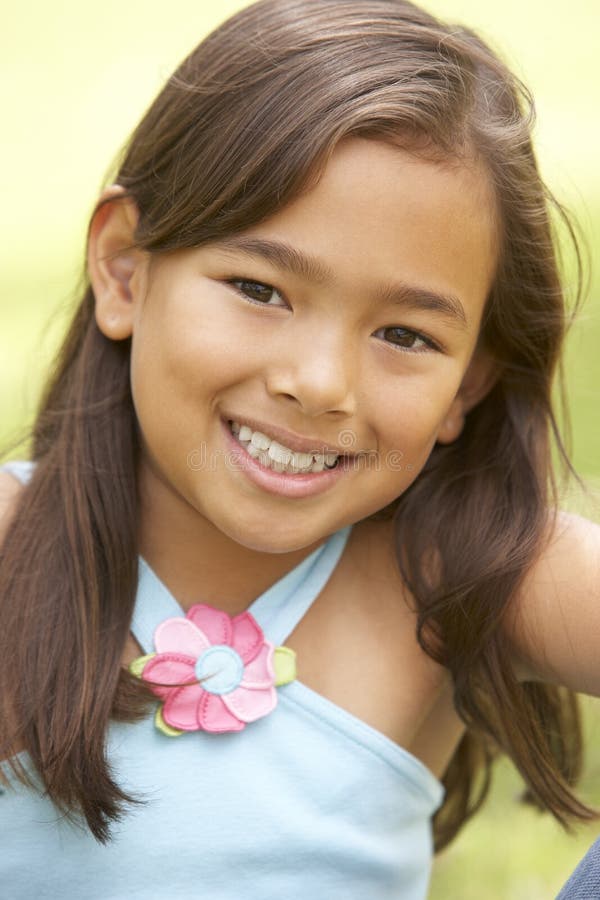 Portrait Of Young Girl In Park