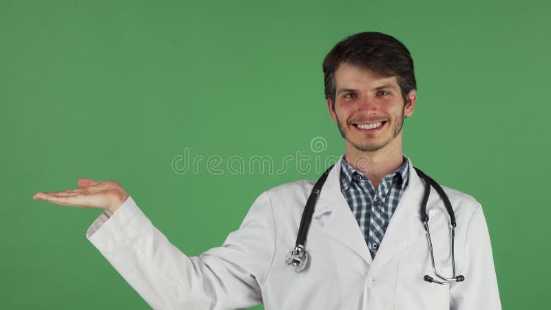 Male doctor smiling holding copy space on his hand royalty free stock images Male doctor smiling holding copy space on his hand royalty free stock images