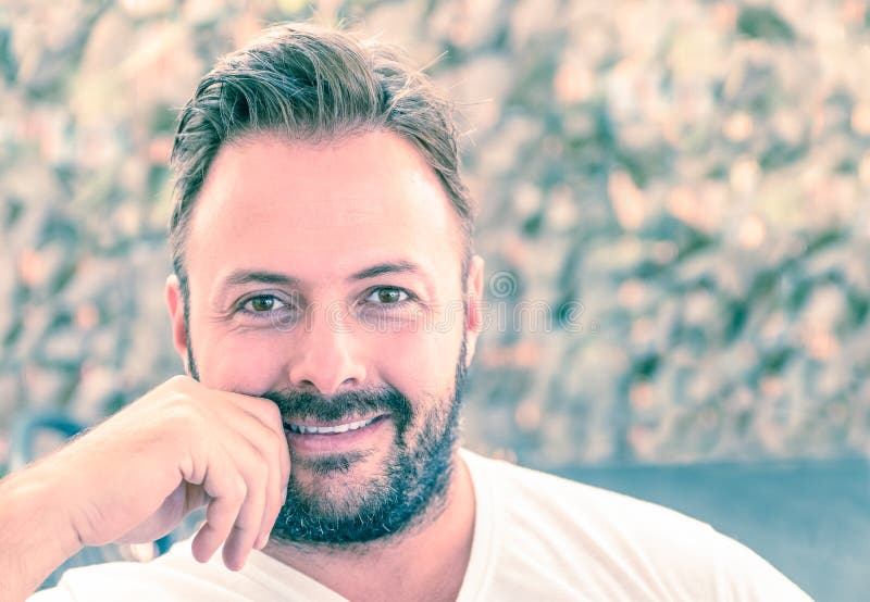 Portrait of a young handsome man with a candid natural smile