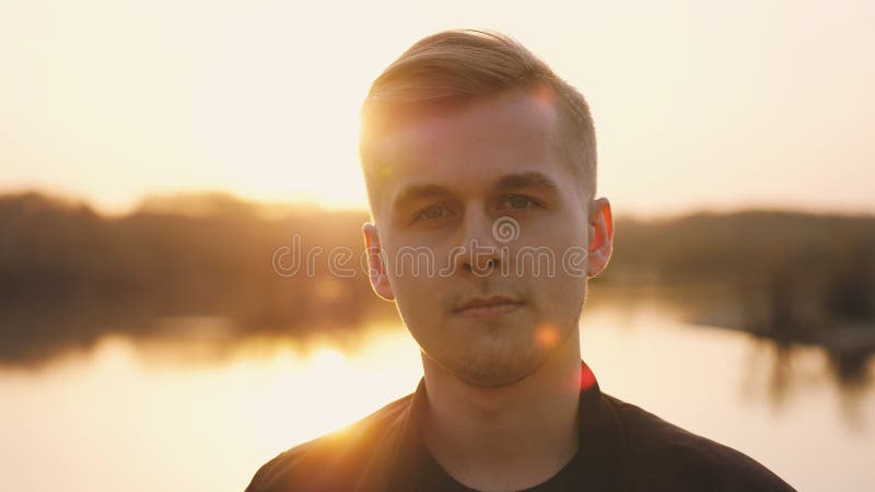 Portrait of Young Handsome Man Enjoying Sunlight during Sunset Stock ...