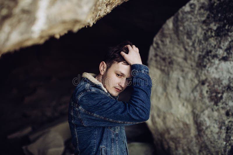 Portrait of young handsome man outdoors in mountains stock images