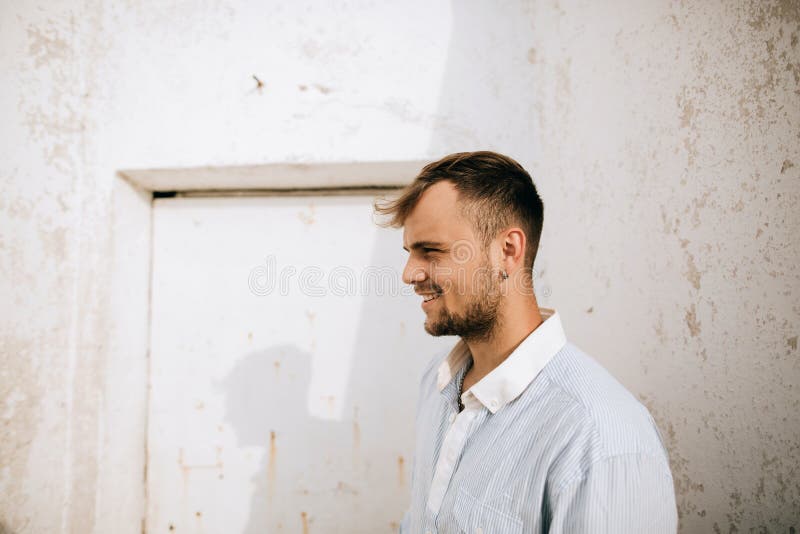 Portrait of a young handsome smiling man. Lifestyle portrait stock photography