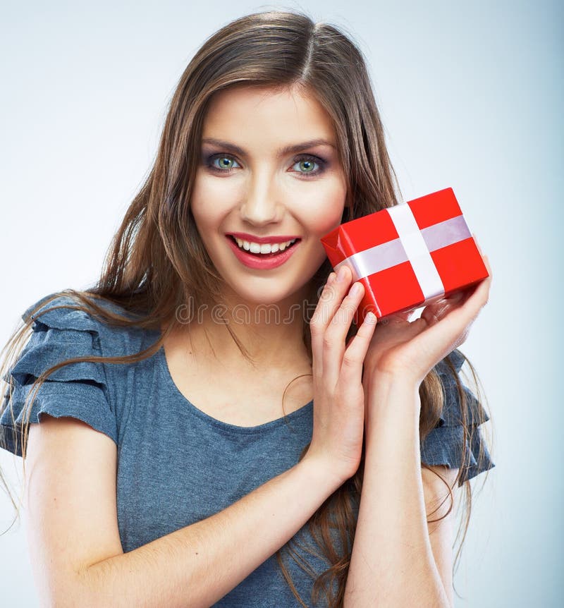 Portrait of young happy smiling woman hold red gift box. Isolat royalty free stock image Portrait of young happy smiling woman hold red gift box. Isolat royalty free stock image
