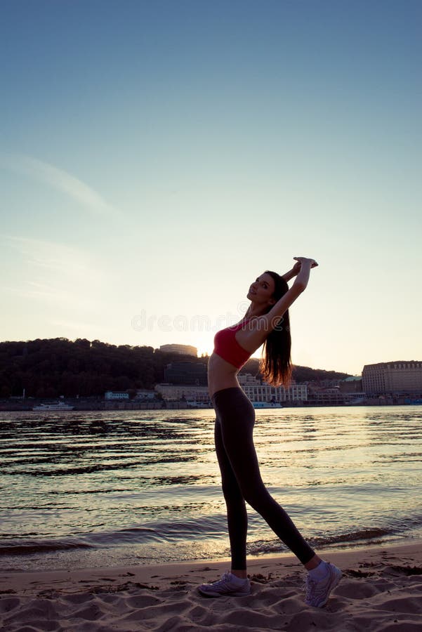 Attractive Slim Girl Stretching Her Legs Near the River Stock Image - Image  of position, moves: 165355723