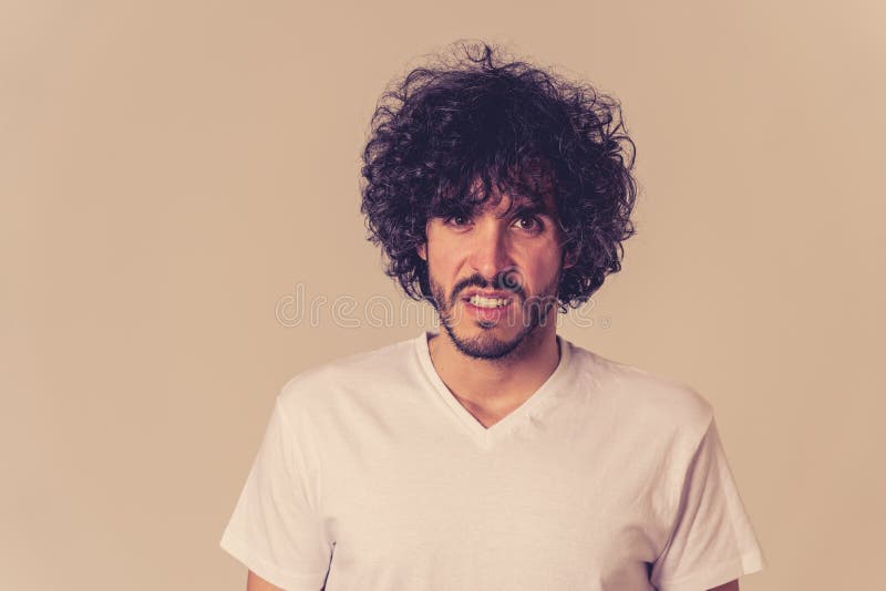 Portrait of young man with angry face looking furious. Human expressions and emotions royalty free stock images Portrait of young man with angry face looking furious. Human expressions and emotions royalty free stock images
