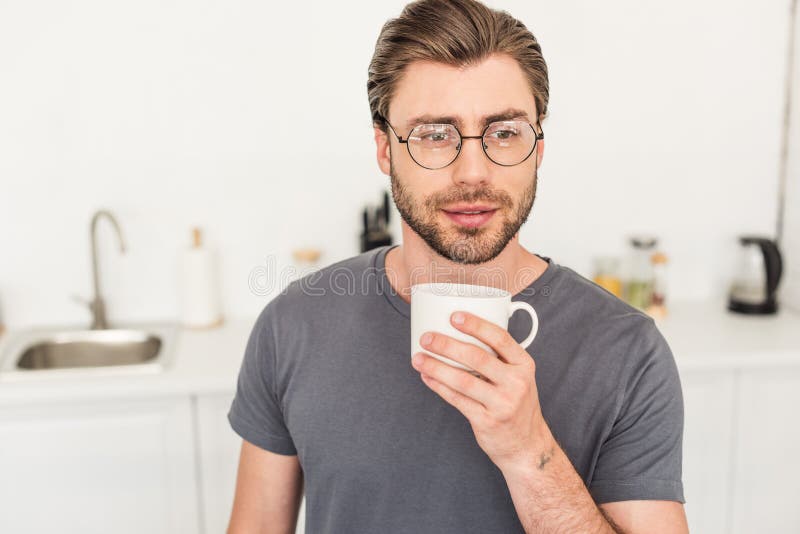 Portrait of Young Man in Eyeglasses Drinking Coffee Stock Image - Image ...