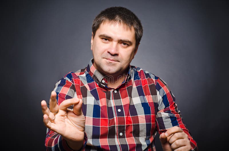 Portrait of young man of gesticulating by hands stock image Portrait of young man of gesticulating by hands stock image