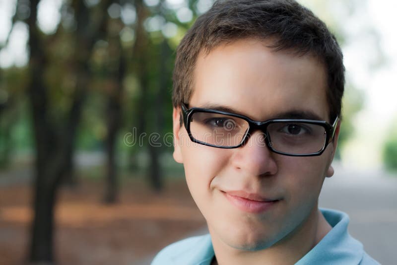 Portrait of young man in glasses