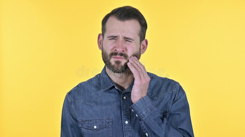The Portrait of Young Man Having Toothache, Yellow Background Stock ...