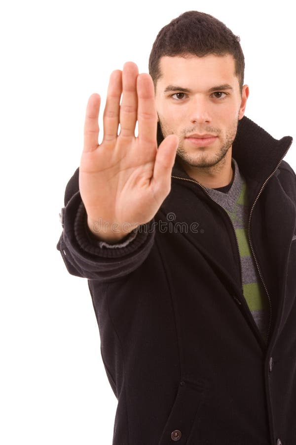 Portrait of young man making stop sign