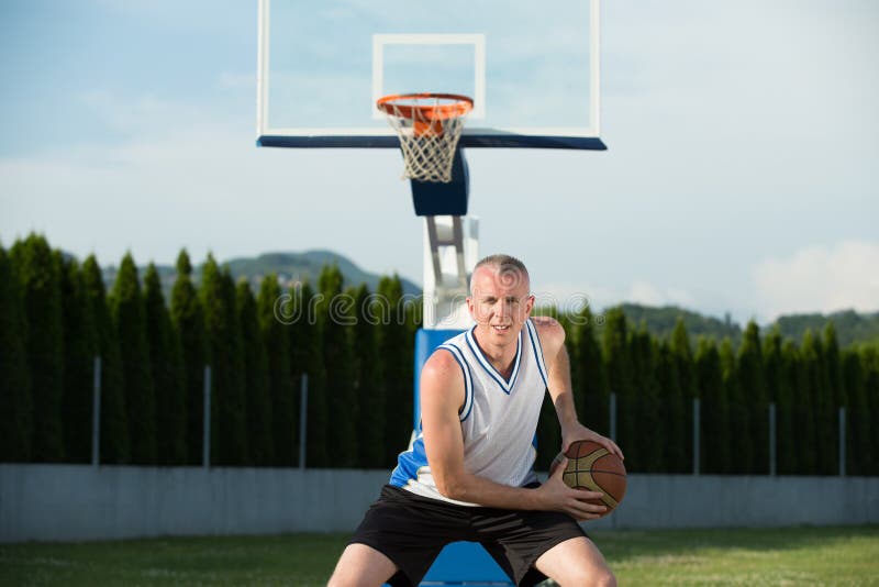 A Man, Standing Tall, Preparing To Shoot a Basketball, in a Park Stock Image Image of cheerful