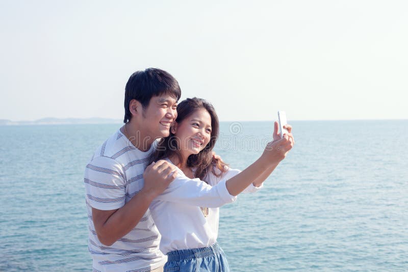 Portrait of young man and woman selfie ,self portrait by mobile