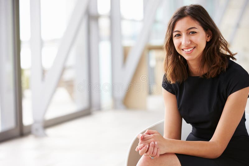 Portrait of young mixed race Asian businesswoman sitting royalty free stock photos Portrait of young mixed race Asian businesswoman sitting royalty free stock photos