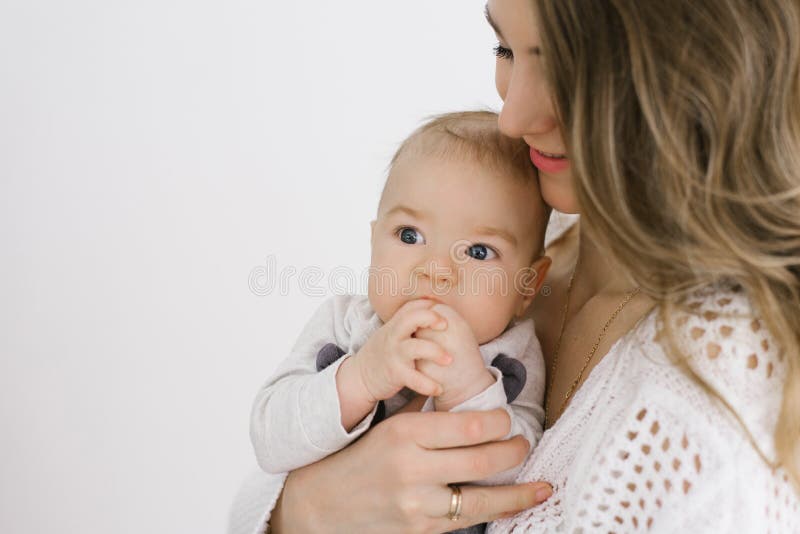 baby keeping hands in mouth