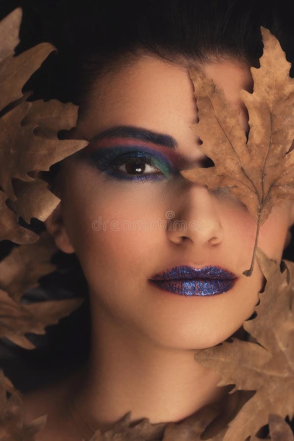 Portrait of young oman over autumn background. Healthcare, makeup and face lifting concept. royalty free stock photos Portrait of young oman over autumn background. Healthcare, makeup and face lifting concept. royalty free stock photos