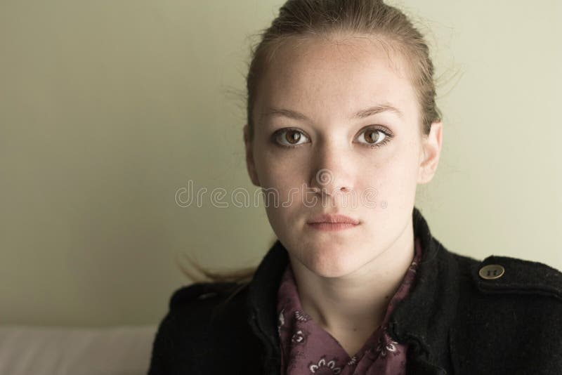 Portrait of young serious teen girl.