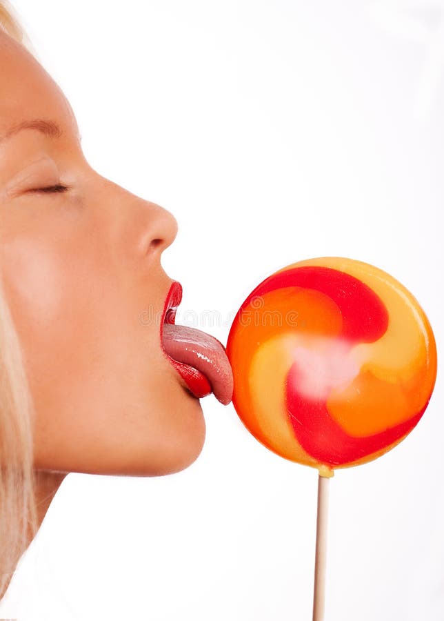 Portrait of young woman lick lollipop