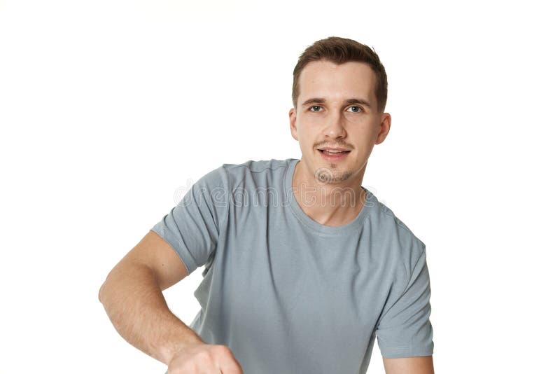 portrait of young smiling man on white stock photography