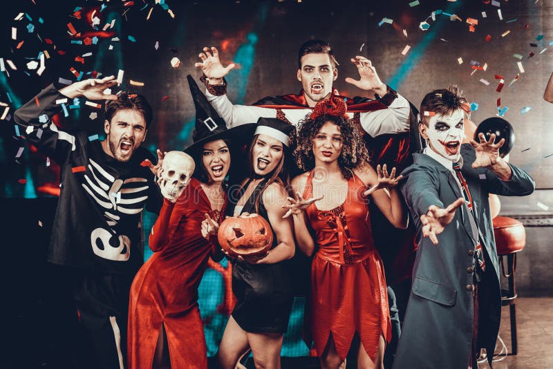 Portrait of Young Smiling People in Scary Costumes royalty free stock photography Portrait of Young Smiling People in Scary Costumes royalty free stock photography