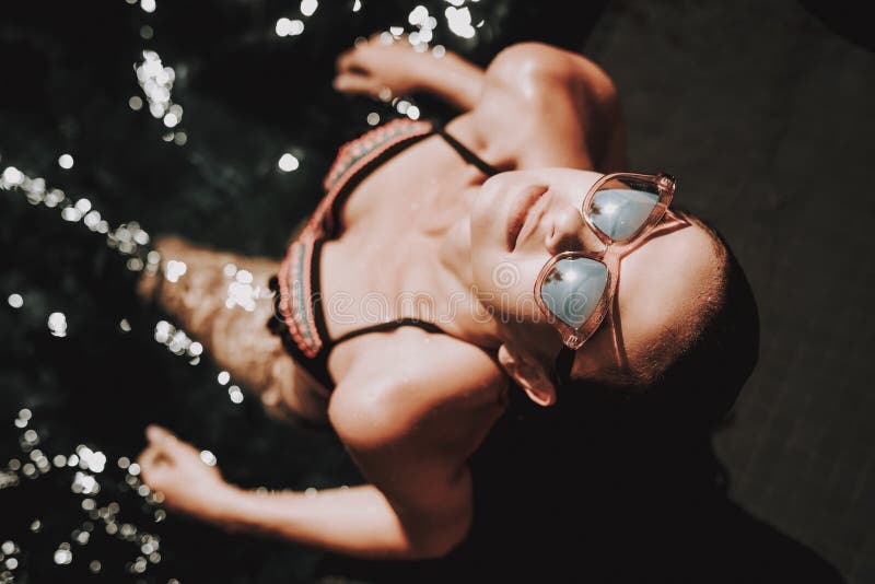 Portrait of Young Smiling Woman Relaxing in Pool stock images Portrait of Young Smiling Woman Relaxing in Pool stock images