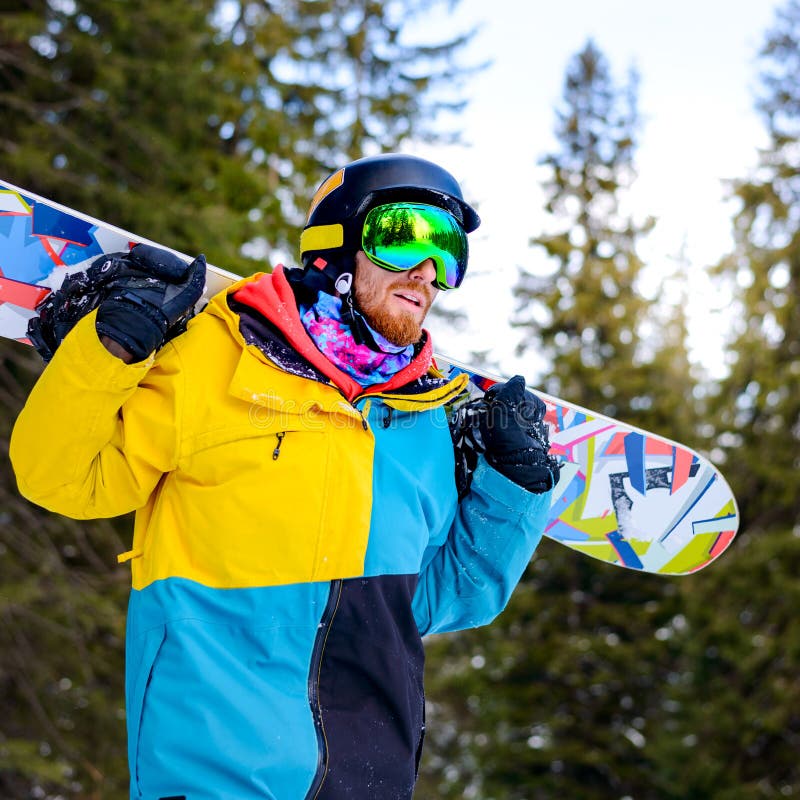 Portrait of Young Snowboarder with the Snowboard in the Winter Forest ...