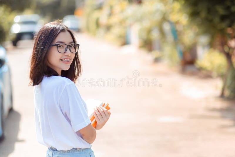 Portrait of young student asian woman wearing braces beauty smile with white teeth