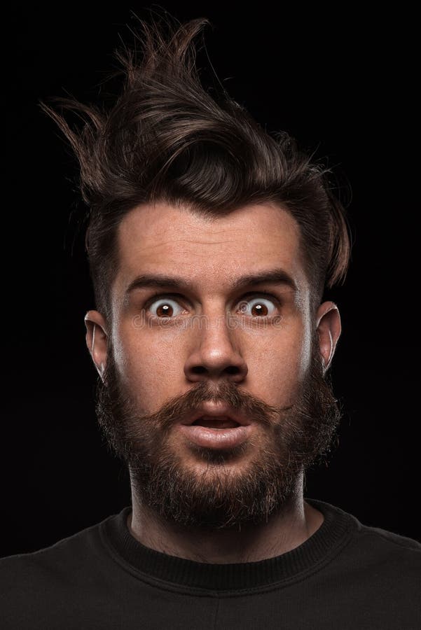 Portrait of young tousled man in studio stock images Portrait of young tousled man in studio stock images