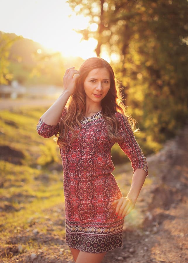 Portrait of Young Woman in Casual Summer Dress, Strong Sunset Backlight ...