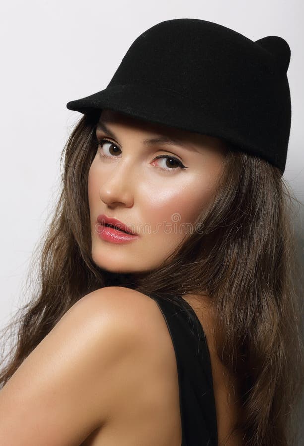Dark hat. Female Fashion with hat portrait.