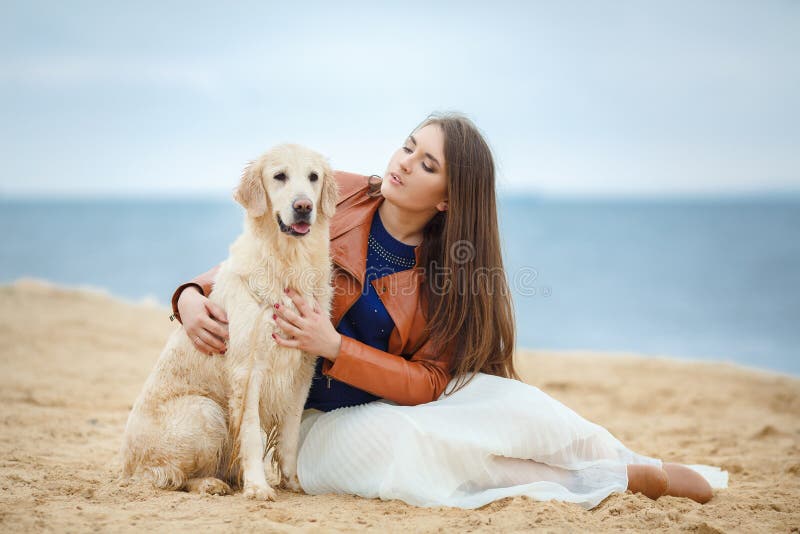 Portrait of a Young Woman with a Dog on the Beach Stock Image - Image ...