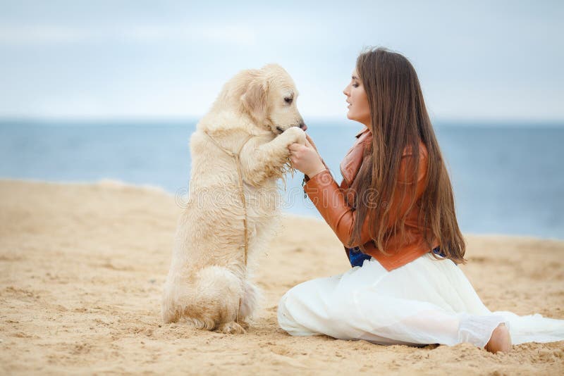 Portrait of a Young Woman with a Dog on the Beach Stock Image - Image ...