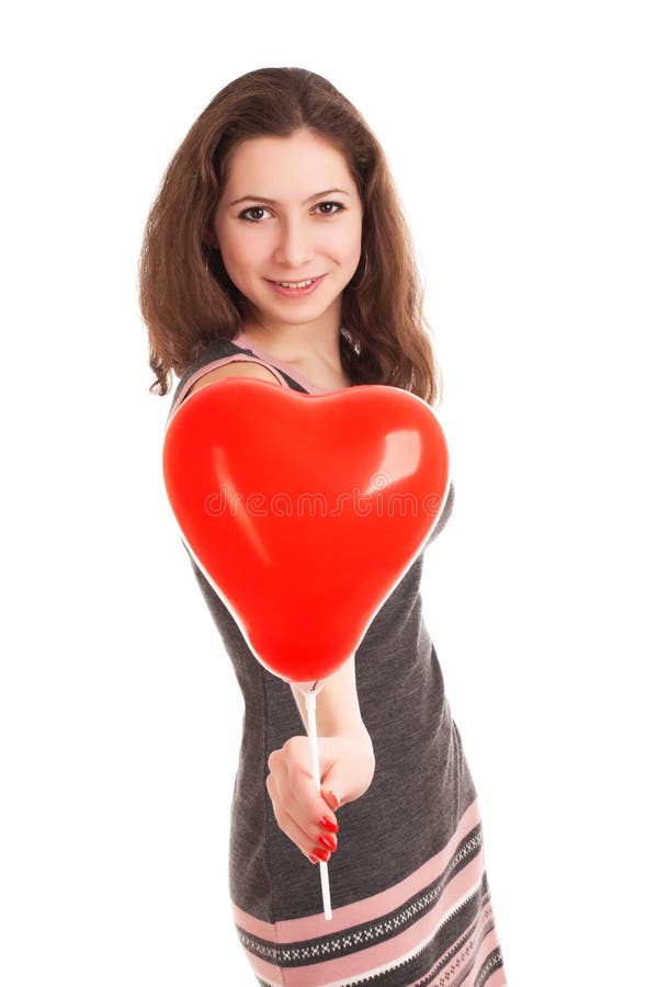 Portrait of young woman holding red balloon