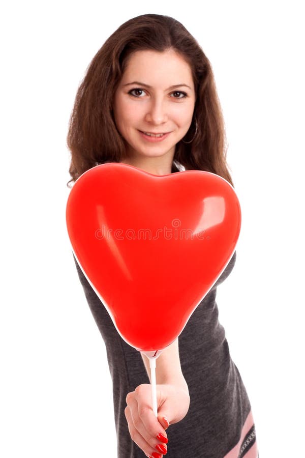 Portrait of young woman holding red balloon