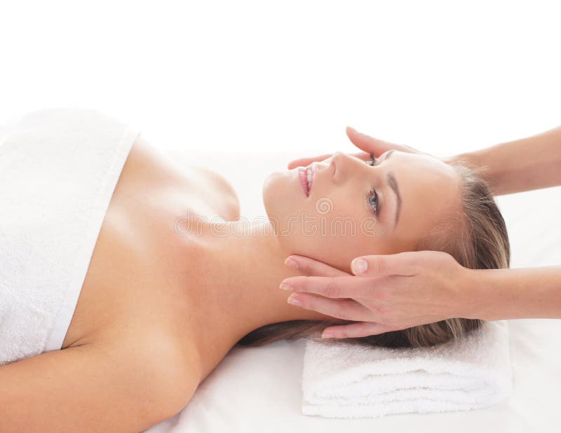 Portrait of a young woman laying on a massage stock image