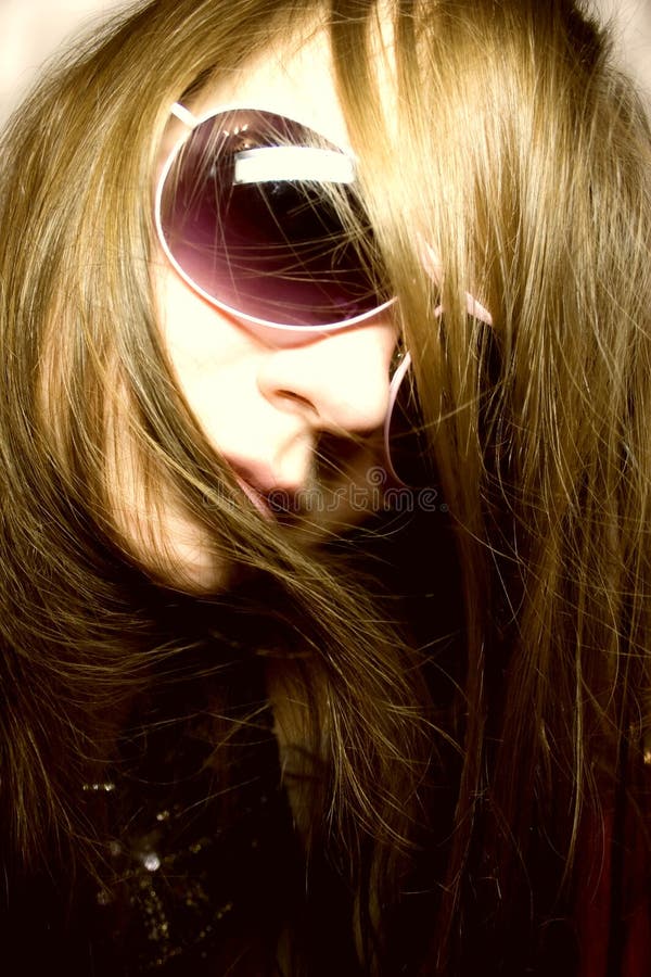 Portrait of the young woman in sunglasses