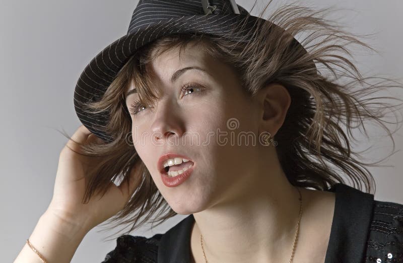 Portrait of a young woman wearing hat