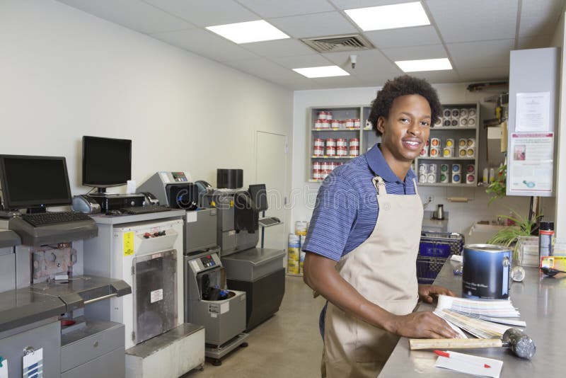 Portrait of an African American male at paint section in super market. Portrait of an African American male at paint section in super market