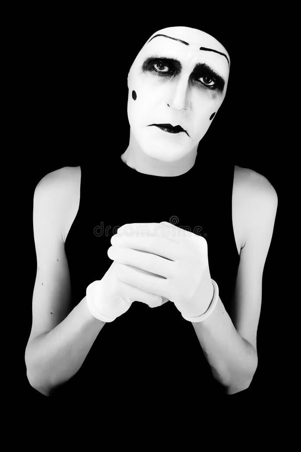 Portret of the mime man, eyes, actor, dark, blue, mime, make-up, white, black, background, mask, humour, theatre, art, portrait, isolated, gloomy, sight, person, face, people, hands, gloves, gesticulation, stain, red, focus, circus, fingers, stop, cross. Portret of the mime man, eyes, actor, dark, blue, mime, make-up, white, black, background, mask, humour, theatre, art, portrait, isolated, gloomy, sight, person, face, people, hands, gloves, gesticulation, stain, red, focus, circus, fingers, stop, cross