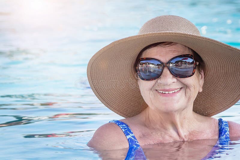 Senior (elderly) Woman (over Age of 50) in Swimsuit, Hat, Sunglasses ...